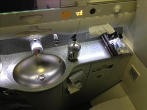 Business class bathroom with amenities